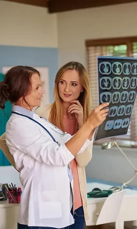 Healthcare professional reviewing scans