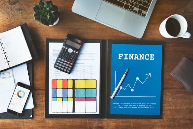 Finance reports and calculator on a desk